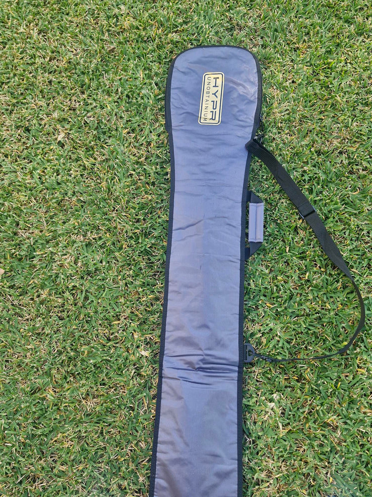 HYPR Paddle Bag – Premium Padded SUP & Surfboard Carry Case resting on grass.